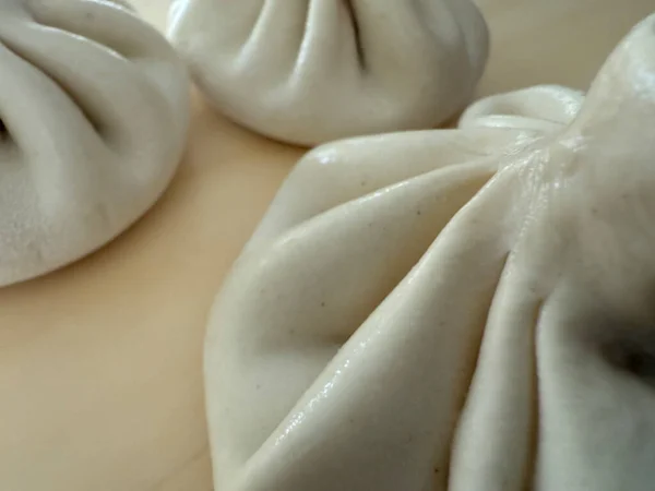 close up of uncooked traditional georgian khinkali dumplings concept of food preparation