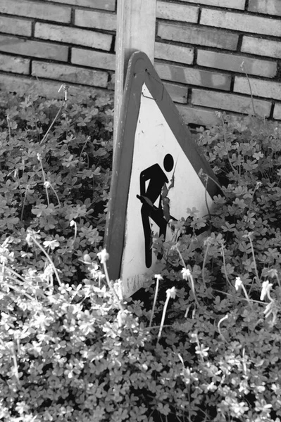 a black and white photo of a man with a gun