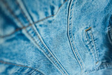Close up view of denim fabric highlighting detailed seams