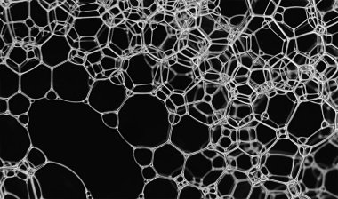 Detailed close up of delicate soap bubbles forming shapes