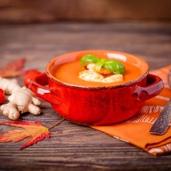Homemade tomato soup with ginger, shrimps and basil on a brown wooden background. Copy space — Stock Image Homemade Tomato Soup Ginger Shrimps Basil Brown Wooden Background Copy Stock Image