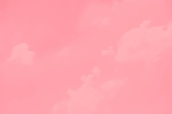 Pastel pink sky background with blurred clouds