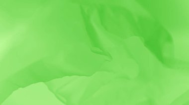 Hafif, narin, uçabilen, taze yeşil kumaş arka plan.