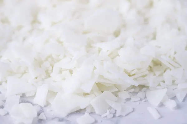 White soy wax flakes for candle making, white wax background