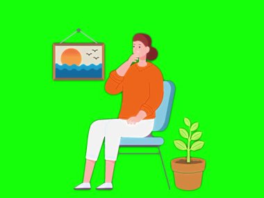 Elinde telefonla sandalyede oturan genç bir kadın.