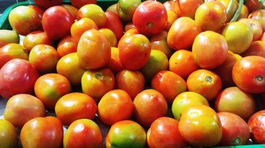 Cherry tomatoes are a small, sweet variety of tomato that are often eaten as a healthy snack or salad addition