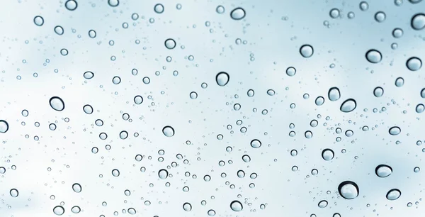 Drops of rain on glass.