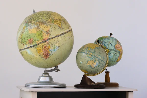 Three terrestrial globe on white bottom — Stock Photo, Image