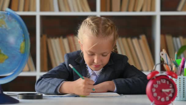 Portrait Little Girl Sitting Table Doing Homework Writing Notebook Elementary — Stock Video