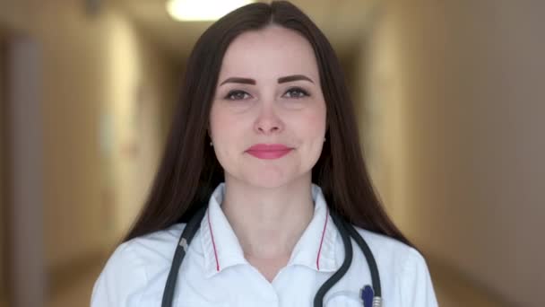 Portrait Smiling Female Doctor Medical Uniform Standing Hospital Corridor Looking — Stock Video