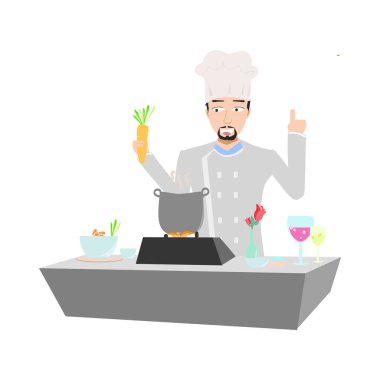 Şef mutfakta yemek pişiriyor.