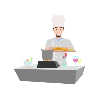 Bir tepsi yiyecekle genç aşçı