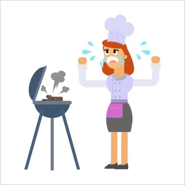 Kadın aşçı mutfakta yemek yapıyor.