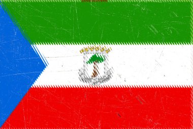 Sıkıntılı Ekvator Gine bayrağı, canlı renklerini ve eskimiş dokusuyla eşsiz tasarımını sergileyerek tarih ve ulusal gurur duygusunu çağrıştırıyor..