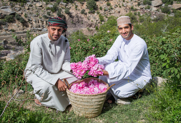 Omani men with rose baskets in Jabal AL Akhdar