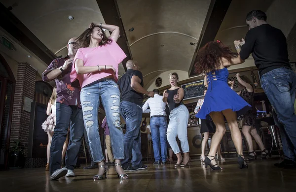 Salsa dancers on a dance floor — Stock Photo, Image