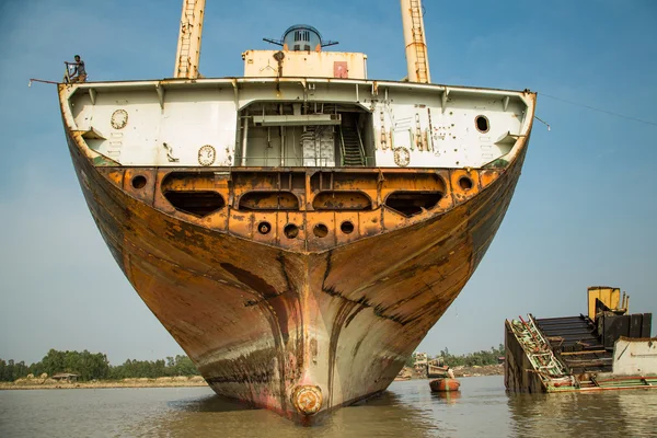 ocean ship being broken down