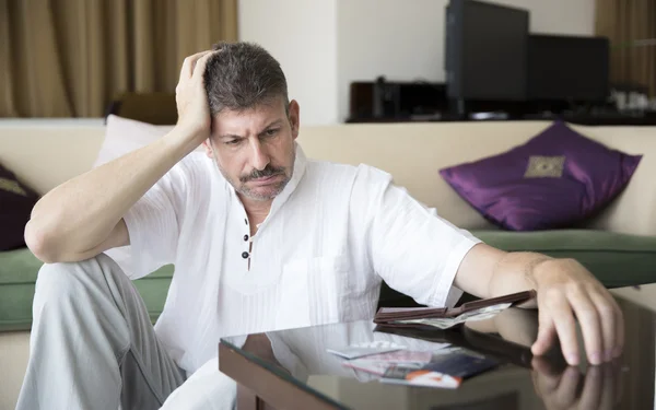 Middle aged man in debt — Stock Photo, Image