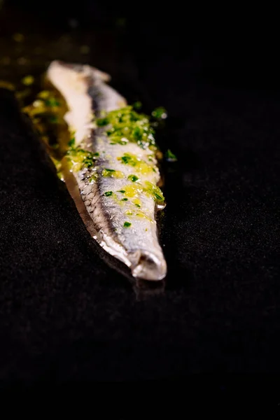 Piece Anchovies Garlic Parsley Oil Black Background — Stock Photo, Image