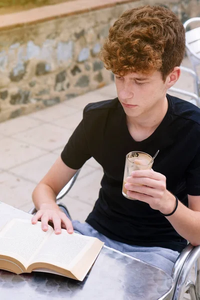 Teen Boy Curly Hair Reading Book Bar — Stock Photo, Image