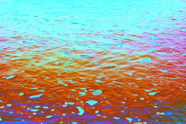 Neon renkli kum ve zemin dokusu canlı ve soyut bir yüzey oluşturuyor. Arkaplan, poster, web tasarımı, reklam ve yaratıcı sanat eserleri için uygun yüksek çözünürlüklü dijital doku.