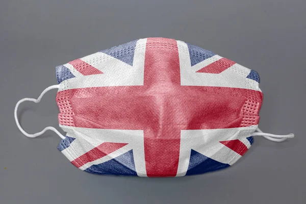 Máscara Protectora Médica Con Bandera Británica Sobre Fondo Gris — Foto de Stock