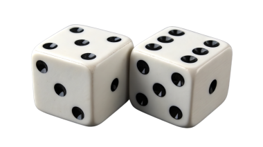 Two white dice showing five and six spots close-up view.