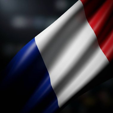 Mavi beyaz ve kırmızı renkleriyle dalgalanan Fransız bayrağının yakın çekimi. Bayrak karanlık bir arkaplana yaslanmış dramatik ve vatansever bir sahne yaratıyor..