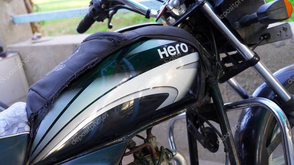 January 2020- Mahroli, Jaipur, India. Selective focus on Hero Motorcycle logo, printed on fuel tank. Attractive bold logo on two wheeler motorcycle.