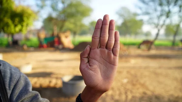 Sharp and clean hand giving symbol to stop to do work. Hand signal expressing stop to work and refusal expression.