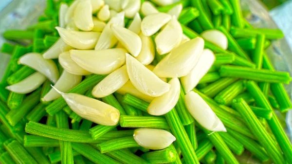 Green beans with white garlic beans. Fresh vegetable with Moringa or Drumstick nods. Healthy beans with garlic fruits.