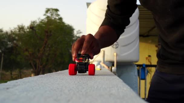 Truck toy driving on floor. Kid's toy going on texture automatic remote system. Truck toy closeup. — Wideo stockowe