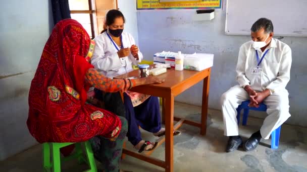 Doctor holding syringe and making injection to senior patient in medical mask. Covid 19 or coronavirus vaccine. — Stock Video