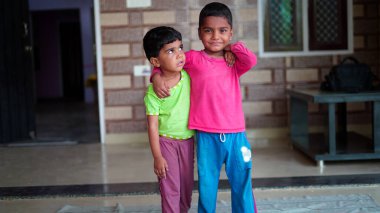 Asian children exercising at home. Family working out at home. Worldwide yoga day concept.