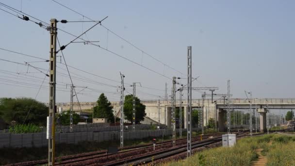 Railroad railway overhead power lines against sky. Contact wire. 4k Footage of Railway line transportation. — Stock Video