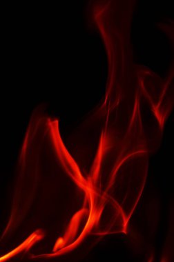 Bu resim parlak, aleve benzeyen kırmızı şekilleri ya da simsiyah bir arkaplana karşı dumanı temsil eder.