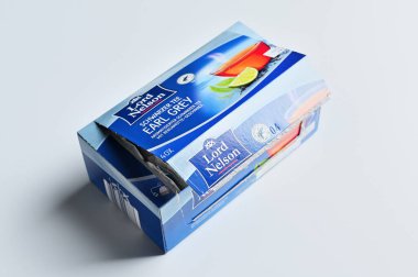 ISERLOHN, GERMANY  MARCH 11, 2026: A metal grave candle vending machine with German text Grablichter standing in front of green bushes