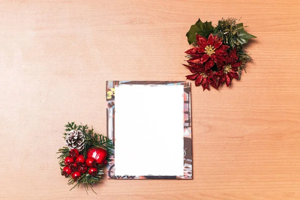 blank photo frame with christmas motif, Christmas Eve with apple, cherry and pine nut arrangement