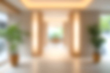 Geniş bir koridorda zarif ışıklandırma ve yemyeşil bitkiler bulunur. Çağdaş bir alanda rahatlama ve rahatlama için ideal sakin bir atmosfer yaratırlar..