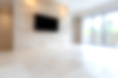 Geniş, modern oturma odası. Minimalist tasarım elementleri sergileniyor. Renk paleti ve geniş doğal ışık..