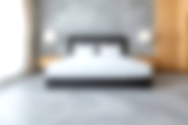 Huzurlu ve davetkar bir modern yatak odası. Hafif ışıklandırma ve nötr tonlara sahip minimalist bir tasarım. Evde rahatlatıcı bir atmosfer yaratmak için mükemmel..