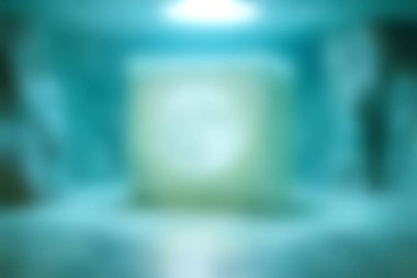 Sakin mavi bir ortamda ışıldayan bir küpün büyüleyici soyut görüntüsü, yumuşak bir odak ve entrika uyandıran ruhani bir ortam sergiliyor..