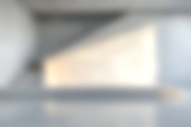 Bu yumuşak odaklı görüntü, asgari dekor ve doğal ışık ile modern mimari bir iç mekan içeriyor, sakin ve zarif bir atmosfer yaratıyor..