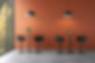 Bu modern iç mekan, canlı turuncu bir duvara karşı siyah bar tabureleri sergiliyor, modern mekanlar için mükemmel şık ve davetkar bir atmosfer yaratıyor..