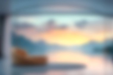 Bu yumuşak odak görüntüsü, sakin bir oturma odası görüntüsü yakalar. Dağların panoramik manzarası ve renkli bir gün batımı, rahatlama ve sükuneti davet eder..