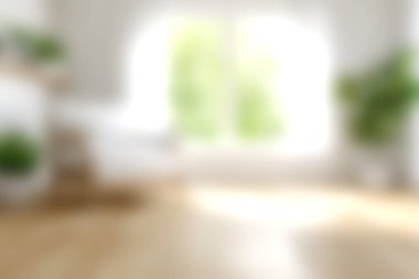 Yeşil bitkilerin ve sıcak ahşap zeminin bulunduğu doğal ışıkla dolu parlak ve havadar bir yaşam alanı. Bu sakin atmosfer rahatlığı ve rahatlığı teşvik eder..