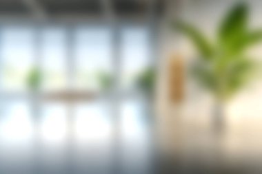 Bu resim, parlak doğal ışık, minimalist tasarım ve verimli ve sakin bir çalışma alanı yaratan yemyeşil bitkilerin yer aldığı modern bir ofis içini gösteriyor..