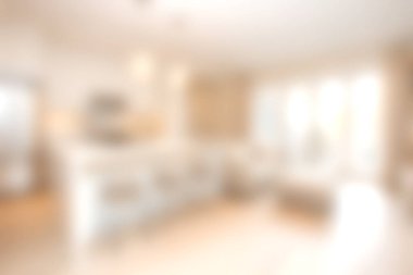 Bu resim, konfor ve tarz için tasarlanmış parlak ve modern bir mutfak tasarımı sergiliyor. Açık alan sıcak renkler, doğal ışık ve parlak armatürlere sahiptir..