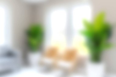 Doğal ışığı davet eden, yeşil bitkileri ve modern mobilyaları rahatlık ve zarafet için sergileyen geniş pencereli, parlak ve rahat bir oturma odası..