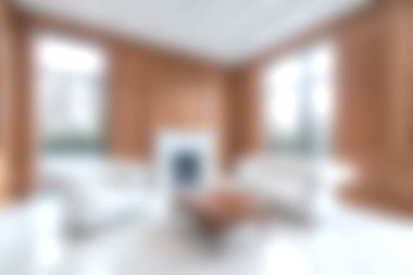 Zarif mobilyaların, bol doğal ışığın ve sıcak tonların olduğu güzel tasarlanmış modern bir oturma odası. Bu rahat alan rahatlığı ve stili vurgular..